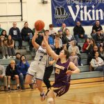 Corey Wiscomb photo.
Even with a roaring Lion in her face, Milana Schneider finds room to lay the ball in for two.