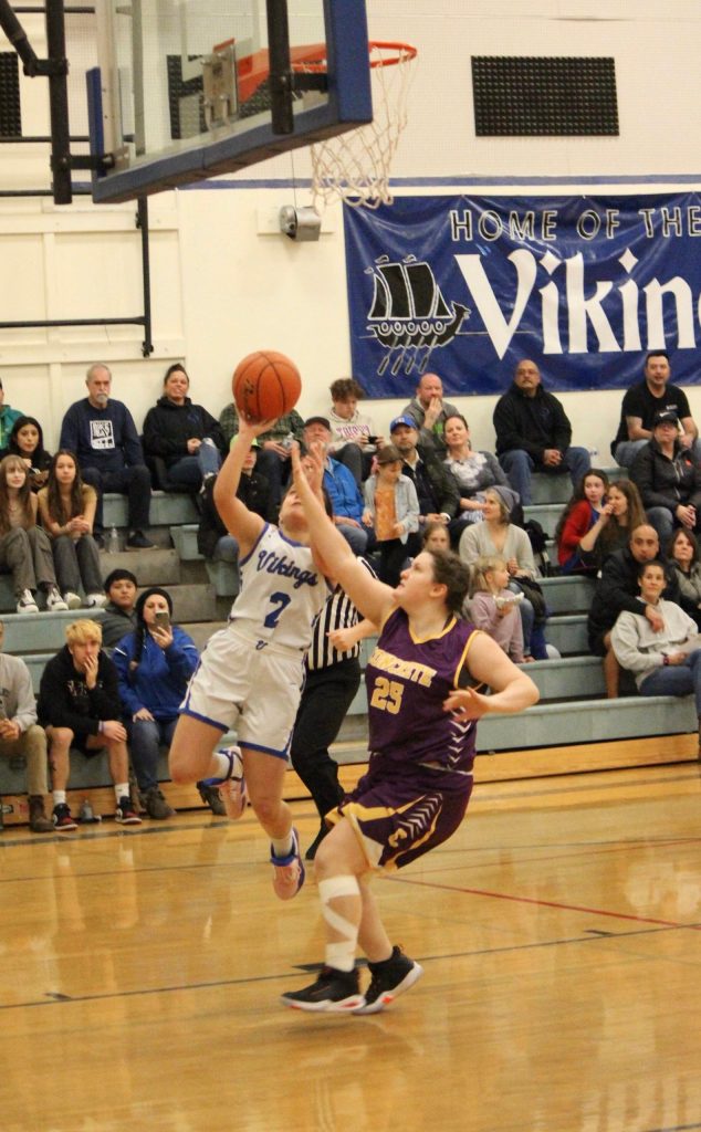 Corey Wiscomb photo.
Even with a roaring Lion in her face, Milana Schneider finds room to lay the ball in for two.