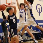 Corey Wiscomb photo.
Feel the pressure! Jefferson Freeman (12) and Andrew Garcia (3) apply an effective backcourt trap against Fellowship Christian.