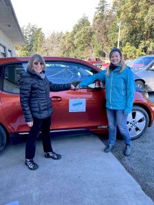 Contributed photo.
Sandy Playa (left) accepted an unexpected donation from Sarah Rehder (right).
