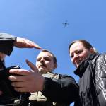 Kelley Balcomb-Bartok / Staff photo
San Juan County Sheriff Deputy Isaac Norton flies the departments new drone as San Juan County Council members Jane Fuller (left) and Christine Minney (right) watch through the drones handheld monitor.