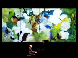 Barry Carlton photo courtesy of OICMF.
Projected painting Chelsea Floral by Martha Farish.