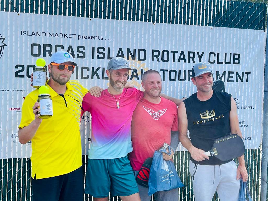 Group A Mens Doubles finishers: Michael Harlow and Valerie Alexandov (second place), and Nigel Oswald and Jemuel Morris (first place).