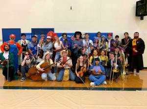 Orcas Island High School band and strings students pose after the Costume/Pops concert in October.
