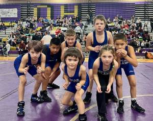 Front row, left to right: Greyson Howard, Caden McGuire-King, Aria Griffin, David Nunez. Back row, left to right: Mario Nunez, Ty Nunez, Michael Neighbors.