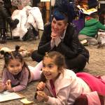 Jenna Moreno with her daughters Vita and Ami (left to right) during the six-week literacy program at the library.