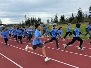 Joyful runners on the school track during the fun run on Nov. 8.