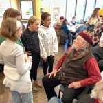 Megan Greene photo.
Left to right: Rose Douglas, Frankie Antonia, Marta Westcott and Eliza Noneman chatting with Ezekiel Barr at the senior center.