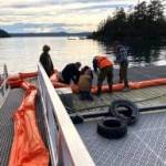 Contributed photo
Volunteers deployting a boom.