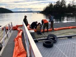 Contributed photo
Volunteers deployting a boom.