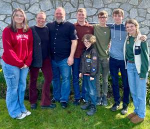 The Moss family in 2023. From left to right, with current ages: Kiley Quill (18), Stephanie, Brian, Levi (24), Ezra (12), Isaac (19), Ethan (19) and Haley (25).