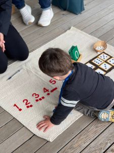 Contributed photo. A young learner plays with numbers.