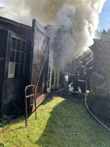 Contributed photo.
OIFR firefighters work to put out a fire on an Olga structure.