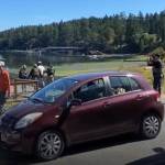 Screenshot from a video provided by Leo Baker as Guilherme Silva was taken onto a boat for transfer. An ICE agent can be seen snapping photos of the marina view behind him.