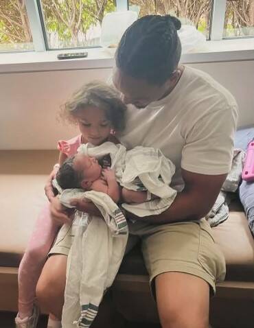 Justice, Norah, and baby Arlo the day he was born