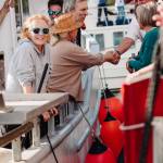 Orcas Video photo.
Orcas Islanders (far left) shaking hands with Canadians during the flotilla.