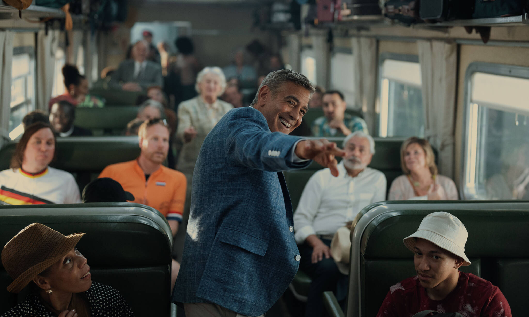 George Clooney (center) as Jay Kelly.