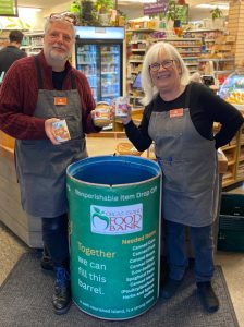 Contributed photo.
Justin and Linda show off the FB barrel at the Orcas Food Co-op.