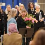 Darrell Kirk photo.
Pamela Wright, right, accepts flowers.