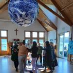 Contributed photo.
Community members circle the Earth.