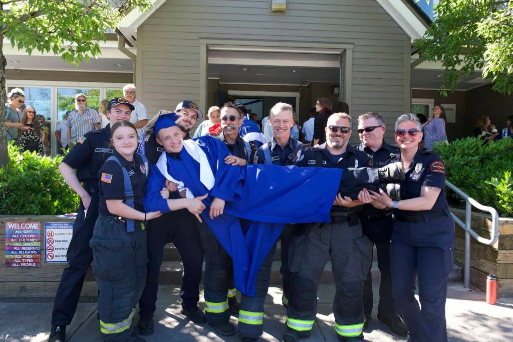 Darrell Kirk photo.
Graduate Kairam Bailey is celebrated by his fellow Orcas Fire and Rescue volunteers.